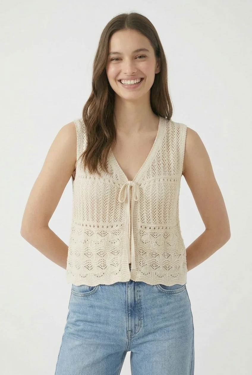 Le cardigan sans manche en maille
